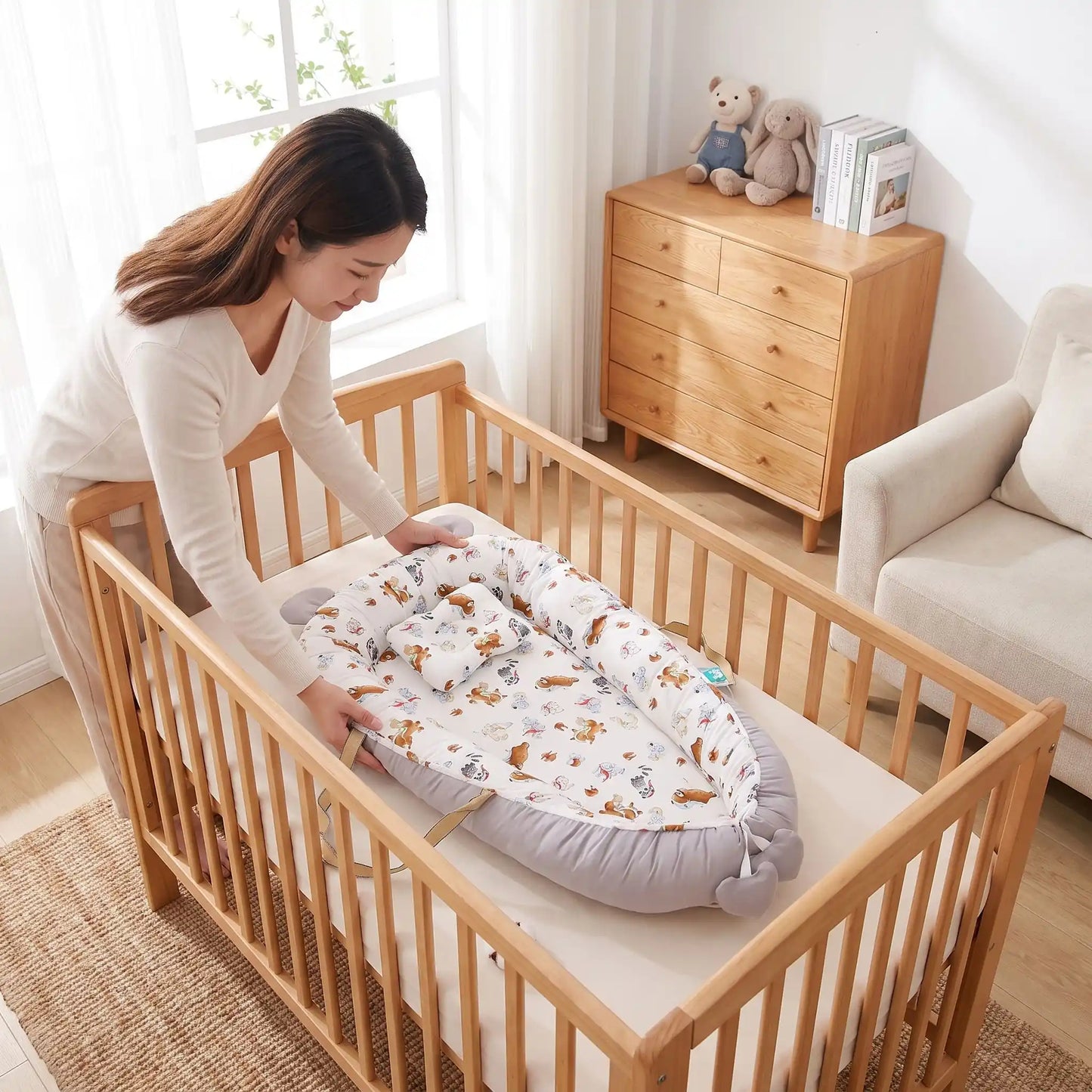 réducteur de lit cododo animaux maman installe lit à barreaux