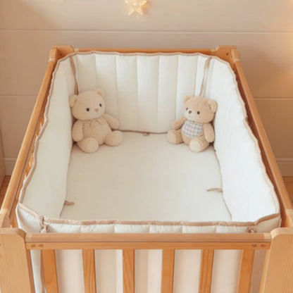tour de lit pare chocs sur lit barreaux peluches